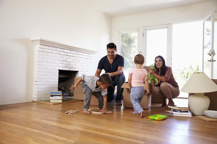 family unpacking at their new home